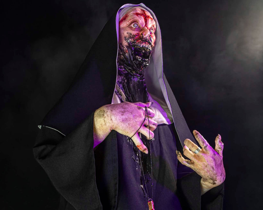 Horror-themed figure in a dark robe with a cross, against a black background